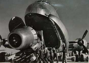 Margaret Bourke-White -&nbsp;Margaret Bourke-White Crewmen Unloading Huge B-50 Bomber Plane Engine Used as a Spare from the Belly of a C-124 Cargo Plane upon Arrival at Strategic Air Command's Base, Greenland, TX