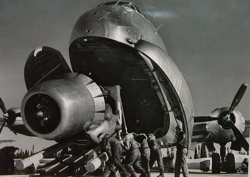 Margaret Bourke-White, Crewmen Unloading Huge B-50 Bomber Plane Engine Used as a Spare from the Belly of a C-124 Cargo Plane upon Arrival at Strategic Air Command's Base, Greenland, TX, 1951
Vintage Silver Gelatin Print, 13 1/2 x 10 inches