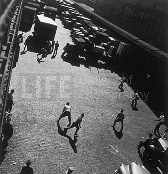 Andreas Feininger - Andreas Feininger Playing Ball Outside Hudson River Pier Sheds, New York