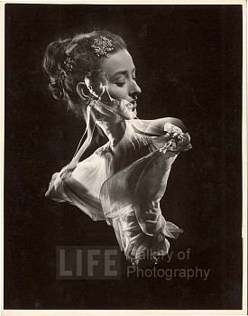 Gjon Mili -&nbsp;Gjon Mili Double Exposure, Model with Swirling Evening Dress over Close up of Her Head with Faux Jewel Hair