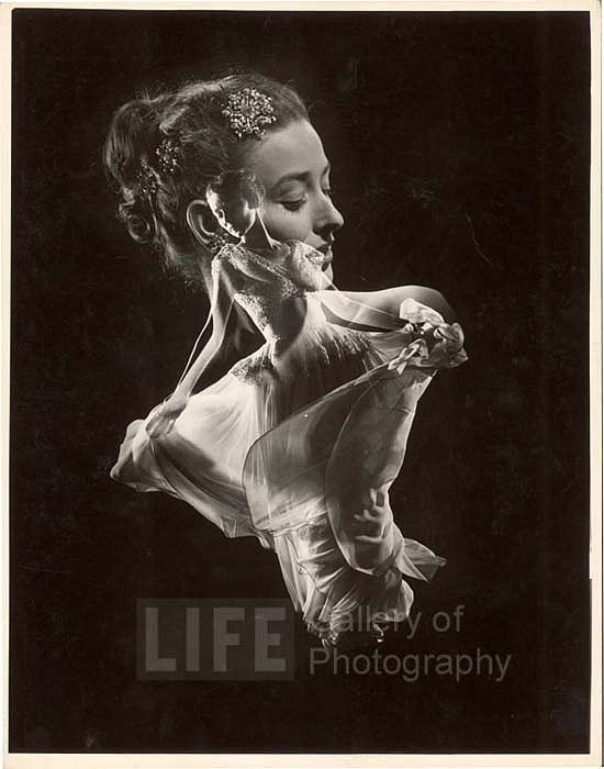 Gjon Mili, Double Exposure, Model with Swirling Evening Dress over Close up of Her Head with Faux Jewel Hair, ca. 1946
Vintage Silver Gelatin Print, 14 x 10 7/8 inches