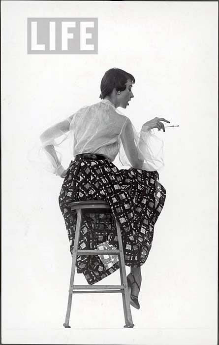 Gjon Mili, Model Dorian Leigh Wearing White Organdy Shirt with Full Print Skirt by Ceil Chapman (face seen in profile), ca. 1950
Vintage Silver Gelatin Print, 10 7/8 x 6 7/8 inches