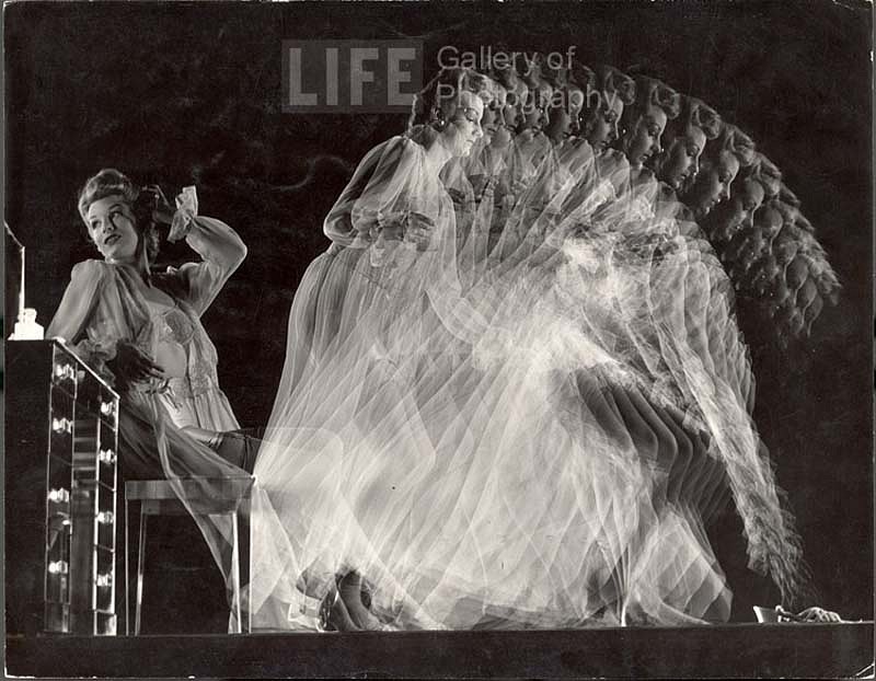 Gjon Mili, Stroboscopic of Model Clad in Girdle, Bra, Stockings and Negligee Seated at Dressing Table and Moving to Pick Up Slippers, ca. 1945
Vintage Silver Gelatin Print, 10 3/8 x 13 3/8 inches