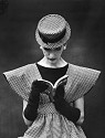 Nina Leen, Model Wearing Checked Wide Shoulder Top with Matching Hat Reading Book Looking Down
1959, Vintage Silver Gelatin Print