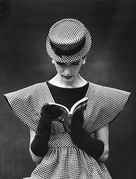 Nina Leen -&nbsp;Nina Leen Model Wearing Checked Wide Shoulder Top with Matching Hat Reading Book Looking Down