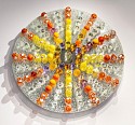 Abby Modell, Starburst Energy  
(Orange/Yellow)
2026, Crackle and silver mirror, hand-blown glass framed